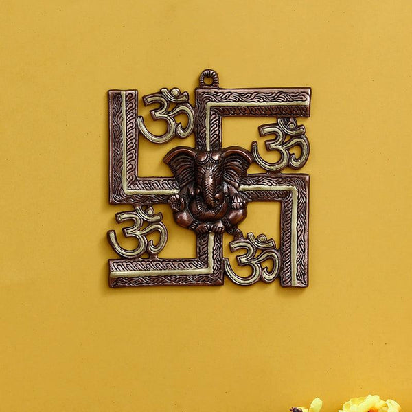 Buy Swastika Om Metal Religious Wall Accent - Golden Brown Wall Accents from Vaaree