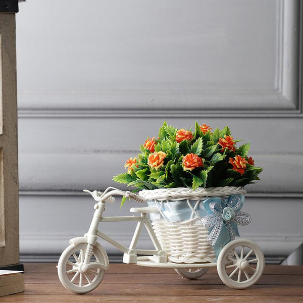 Buy Faux Orange Rose Plant On Cycle Rikshaw Artificial Plants from Vaaree